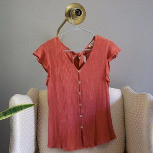 Salmon colored top